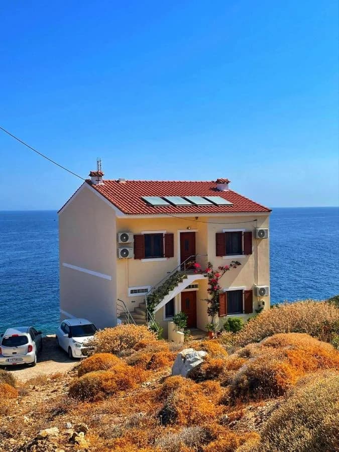 The white Kochili apartments beside the Aegean